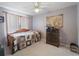Bedroom with hardwood floors and a ceiling fan at 4461 Baroda Ave, North Port, FL 34287