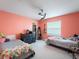 Colorful bedroom featuring two beds, ceiling fan and walk-in closet at 4461 Baroda Ave, North Port, FL 34287