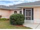 Close-up of the front entrance with a decorative storm door and arched windows at 4461 Baroda Ave, North Port, FL 34287