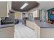 Well-lit kitchen with ample counter space, modern appliances, and neutral-toned cabinetry at 4461 Baroda Ave, North Port, FL 34287