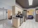 Functional kitchen with stainless steel appliances and easy access to both the foyer and living room at 4461 Baroda Ave, North Port, FL 34287
