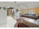 Open-concept living room flows into the kitchen, featuring hardwood floors and a comfortable sectional sofa at 4461 Baroda Ave, North Port, FL 34287