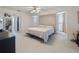 Bright main bedroom with a king bed, light-colored walls and carpet at 4461 Baroda Ave, North Port, FL 34287