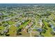 Expansive aerial view of a residential community with well-manicured lawns and mature trees at 450 Santiguay St, Punta Gorda, FL 33983