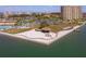 Stunning aerial view of the community featuring lake access with a gazebo, sandy area, and well-maintained green spaces at 5020 Brittany S Dr # 324, St Petersburg, FL 33715