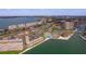 Aerial view of condo community with pool, waterfront access, and surrounding cityscape at 5020 Brittany S Dr # 324, St Petersburg, FL 33715