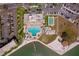 Aerial view of community amenities, including a pool, parking, tennis court, and lake access, providing a complete recreational experience at 5020 Brittany S Dr # 324, St Petersburg, FL 33715