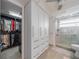 Spacious bathroom with a glass-enclosed shower, generous storage and a walk-in closet at 5020 Brittany S Dr # 324, St Petersburg, FL 33715
