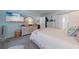 Cozy bedroom with a plush bed, soft lighting, and a calming blue color scheme for relaxation at 5020 Brittany S Dr # 324, St Petersburg, FL 33715