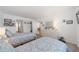Bright bedroom features two twin beds with neutral walls and a doorway leading to other rooms, creating an open feel at 5020 Brittany S Dr # 324, St Petersburg, FL 33715