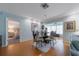 Dining area with hardwood floors, views to living and bedroom area at 5020 Brittany S Dr # 324, St Petersburg, FL 33715