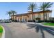 Exterior shot of the beautiful community clubhouse with mature palm trees and meticulous landscaping at 5020 Brittany S Dr # 324, St Petersburg, FL 33715