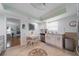Charming kitchen featuring a cozy breakfast nook, stainless steel appliances and white cabinetry at 5020 Brittany S Dr # 324, St Petersburg, FL 33715