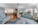 Spacious living room with hardwood floors, stylish furnishings, and lots of natural light at 5020 Brittany S Dr # 324, St Petersburg, FL 33715