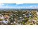 An elevated view of a residential area nestled within a lush, green landscape with waterfront views at 5239 Siesta Cove Dr, Sarasota, FL 34242