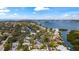 A beautiful coastal community showing homes along canals leading to a wide open bay under blue skies at 5239 Siesta Cove Dr, Sarasota, FL 34242