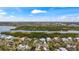 Scenic aerial view capturing waterfront homes nestled amidst lush greenery and tranquil waters at 5239 Siesta Cove Dr, Sarasota, FL 34242