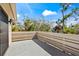 This concrete balcony with sleek railings offers a private outdoor space and neighborhood views at 5239 Siesta Cove Dr, Sarasota, FL 34242