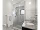 Contemporary bathroom featuring a glass-enclosed shower, sleek vanity, and modern fixtures at 5239 Siesta Cove Dr, Sarasota, FL 34242