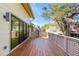 Spacious wooden deck perfect for outdoor entertaining with a view of the surrounding landscape at 5239 Siesta Cove Dr, Sarasota, FL 34242