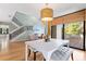 Bright and spacious dining area with modern lighting and a view to the deck at 5239 Siesta Cove Dr, Sarasota, FL 34242