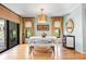 Dining area with sliding doors leading to the pool, featuring modern furnishings at 5239 Siesta Cove Dr, Sarasota, FL 34242
