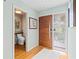 Inviting foyer showcasing a modern front door, tile flooring, and natural light at 5239 Siesta Cove Dr, Sarasota, FL 34242
