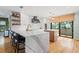Well-appointed kitchen featuring marble countertops, stainless steel appliances, and designer lighting at 5239 Siesta Cove Dr, Sarasota, FL 34242