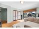 Cozy sitting area featuring wooden floors, natural light, and access to a balcony at 5239 Siesta Cove Dr, Sarasota, FL 34242