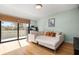 Living room with a large window with natural light and wooden floors at 5239 Siesta Cove Dr, Sarasota, FL 34242