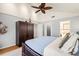 Bright bedroom with neutral colors, large wardrobe, and hardwood floors at 5239 Siesta Cove Dr, Sarasota, FL 34242