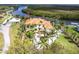 Stunning waterfront estate with lush landscaping, circular driveway, and panoramic views of the river at 7440 Riverside Dr, Punta Gorda, FL 33982