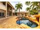 Beautiful pool area with lush landscaping and a spacious backyard, perfect for outdoor living at 7440 Riverside Dr, Punta Gorda, FL 33982