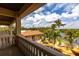 A luxurious balcony view overlooking the pool, lush landscaping, and waterfront, perfect for relaxation and entertaining at 7440 Riverside Dr, Punta Gorda, FL 33982