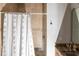 Bathroom featuring tile shower, glass door, marble counter-tops and shower curtain at 7440 Riverside Dr, Punta Gorda, FL 33982