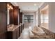 Elegant bathroom with marble tile, soaking tub, separate shower, and lots of storage at 7440 Riverside Dr, Punta Gorda, FL 33982