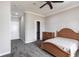 Well-lit bedroom with a neutral color palette, plush carpet, bed, closet and ensuite bathroom access at 7440 Riverside Dr, Punta Gorda, FL 33982
