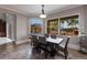 Dining room featuring lots of sunlight, modern table and chairs, and a view of the pool at 7440 Riverside Dr, Punta Gorda, FL 33982