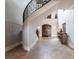 Grand foyer showcasing a spiral staircase and beautiful tile flooring at 7440 Riverside Dr, Punta Gorda, FL 33982