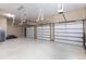 Spacious three-car garage offering abundant storage with epoxy floors at 7440 Riverside Dr, Punta Gorda, FL 33982