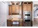 This kitchen includes sleek stainless steel ovens and granite countertops with an integrated desk area for convenience at 7440 Riverside Dr, Punta Gorda, FL 33982