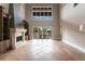 Spacious living room with a stone fireplace and sliding glass doors to the outside patio at 7440 Riverside Dr, Punta Gorda, FL 33982