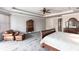 Bedroom features an arm chair, bed, furniture set, ceiling fan and carpet at 7440 Riverside Dr, Punta Gorda, FL 33982