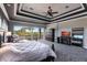 This is a spacious main bedroom with a fireplace and a private balcony overlooking beautiful greenery at 7440 Riverside Dr, Punta Gorda, FL 33982