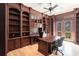 Home office with custom wood built-ins, desk area, and natural light, ideal for working remotely at 7440 Riverside Dr, Punta Gorda, FL 33982