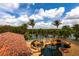 Inviting pool area features waterfall features, lush landscaping, and clear blue water perfect for relaxation at 7440 Riverside Dr, Punta Gorda, FL 33982