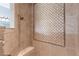 Detail of a shower featuring natural stone and mosaic tiles at 7440 Riverside Dr, Punta Gorda, FL 33982