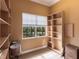 Well-organized storage room featuring custom built shelving, natural light, and ample storage space at 7440 Riverside Dr, Punta Gorda, FL 33982