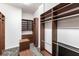 Spacious walk-in closet with custom shelving and drawers for optimal storage and organization at 7440 Riverside Dr, Punta Gorda, FL 33982