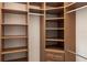Beautiful walk-in closet with ample storage including shelving, drawers, and hanging space at 7440 Riverside Dr, Punta Gorda, FL 33982